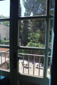 an open window with a view of a patio at Lotel Casa Noble in Valencia
