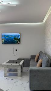 a living room with a couch and a coffee table at Cascade Resort Sevan in Sevan