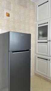 a refrigerator in a kitchen with a wall at Villa Korba 2nd Floor in Korba
