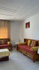 a living room with two couches in a room at Villa Korba 2nd Floor in Korba