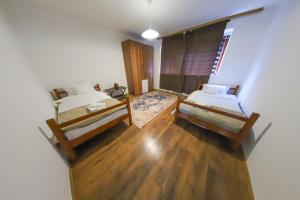 an overhead view of a bedroom with two beds at Una & Lake oasis in Bihać