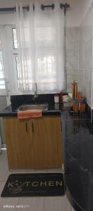 a kitchen with a sink and a counter top at 1 bedroom BNB Meru in Meru +53 photos
