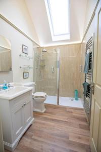 a bathroom with a sink toilet and a shower at Converted Barn - Romantic Countryside Escape in Cupar +31 photos