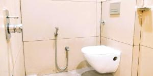 a bathroom with a toilet and a shower at Vista10 in Bhopal