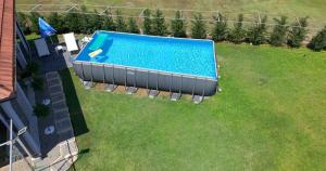 an overhead view of a swimming pool in a yard at Hidden Oasis PeSa - Luxury Villa with Pool & Spa in Podgorica