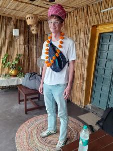 a woman wearing a hat and a necklace at Veda Heritage Haveli in Udaipur +103 photos