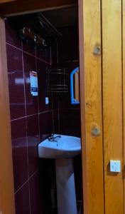 a bathroom with a toilet and a sink in it at double room in Ureki