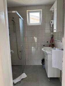 a bathroom with a shower and a sink at Ivanović smeštaj in Rose +35 photos