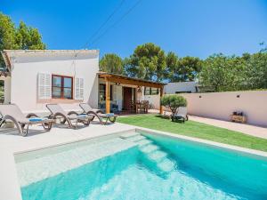 a villa with a swimming pool and a house at 3-Bed Villa with Pool, Puerto Pollença in Port de Pollensa