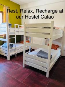 a group of bunk beds in a room at Hostel Calao in Shkodër