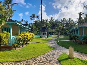 a view of a resort with palm trees and houses at Villas Palmar Residence Beachfront Villas & Studios in Las Terrenas