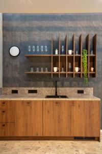 a kitchen with a sink and a counter at Bob W Dortmund Stadtmitte in Dortmund