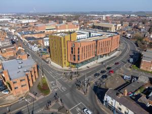 an aerial view of a city with a large building at Student Only Studio in Central Loughborough in Loughborough