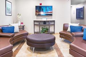 a waiting room at a hospital with couches and a table at Candlewood Suites Killeen - Fort Hood Area by IHG in Killeen