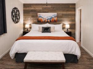 a bedroom with a large bed and two lamps at Beechview Condo in Beech Mountain +18 photos