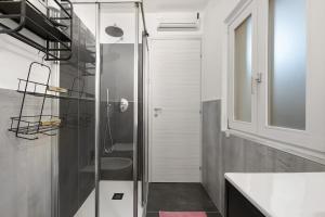 a bathroom with a shower and a sink at Il Roncaccio Residence Colico in Colico +79 photos