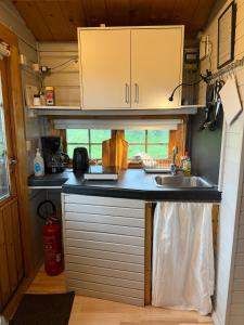a kitchen with a sink and a counter top at Egilsstadir 1, Skógarkot, Urridafossvegur, Selfoss in Selfoss +4 photos