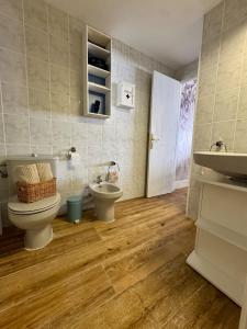 a bathroom with a toilet and a sink at Max in Tossa de Mar +18 photos