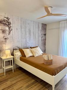 a bedroom with a bed and a ceiling fan at Max in Tossa de Mar