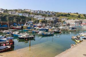 a bunch of boats are docked in a harbor at Stones Throw in St Austell