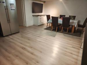 a kitchen and dining room with a table and chairs at Villan Lyan in Lund +10 photos