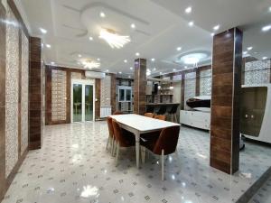 a dining room with a table and chairs at Villa skikda in Skikda