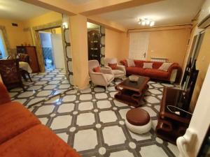 a large living room with couches and a table at Villa skikda in Skikda