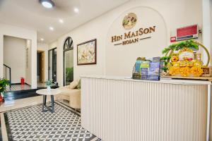 a store front with a counter in a room at Maison Hin in Hoi An