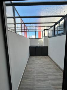 an empty balcony of a building with a glass ceiling at Nakhla in Dar Bouazza