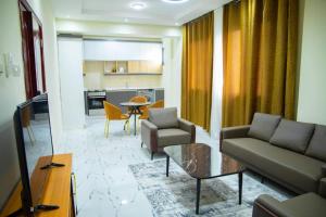 a living room with a couch and a table at Star home Tower in Mogadishu