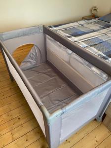 a bed with an empty bed frame in a room at Talblick in Oberroßla