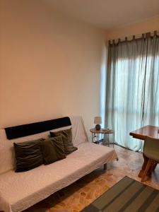 a living room with a couch and a table at Nicole's House in Asti