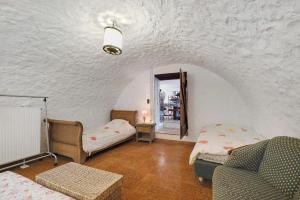 a living room with a couch and a chair at La Lufrerie in Sospel +32 photos