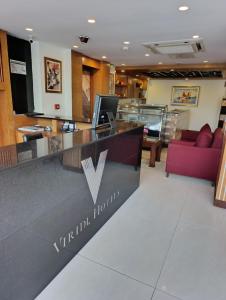 a lobby of a hotel with a reception desk at Viridi Hotels Islamabad in Islamabad