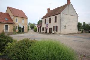 an empty street in a small town with houses at Georgeluc in Langeron