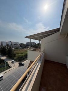 a balcony with a view of a parking lot at Apartament Golem in Golem