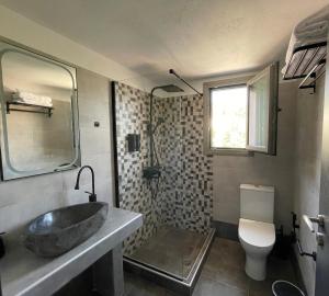 a bathroom with a sink and a toilet at Faos residence I in Pefkias +33 photos