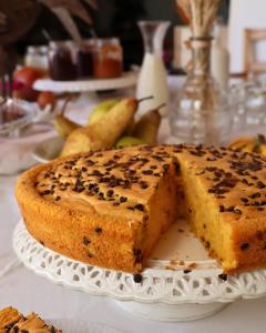a cake on a plate with a slice missing at Agriturismo Al Capretto in San Vendemiano