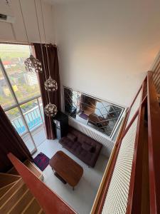 an overhead view of a living room with a table at Apartemen Gresik in Panggang