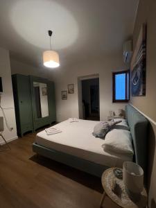 a bedroom with a bed and a couch at A-mare Numana in Numana