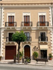 a building with bikes parked in front of it at Le Tartarughe - Rooms and Apartments - in Milazzo