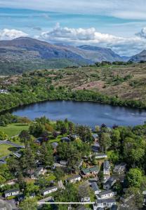 an aerial view of a town with a lake at Caravan no 69 in Cwm-y-glo