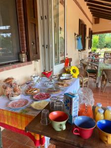 a table with a bunch of food on it at B&B la boffalora in Zaffignano +4 photos