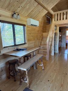 a desk in a log cabin with a window at Tiny Cabin #1 by Windham NY Escape 'Catskill Gem' in Hensonville