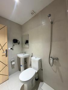 a bathroom with a toilet and a sink at Nezha Hotel in Tangier