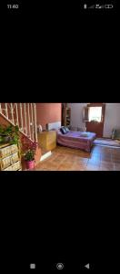 two pictures of a bedroom with a bed in it at Casa Aire del Sur in Órgiva