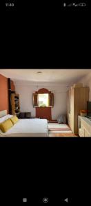 a bedroom with a large bed and a window at Casa Aire del Sur in Órgiva