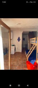 a small room with two bunk beds in it at Casa Aire del Sur in Órgiva