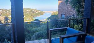 a balcony with a view of a body of water at Cormorants' View Self Catering accommodation in Sedgefield