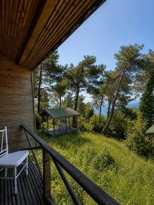 a porch with a chair and a gazebo at Diamond Koru Hotel in Amasra